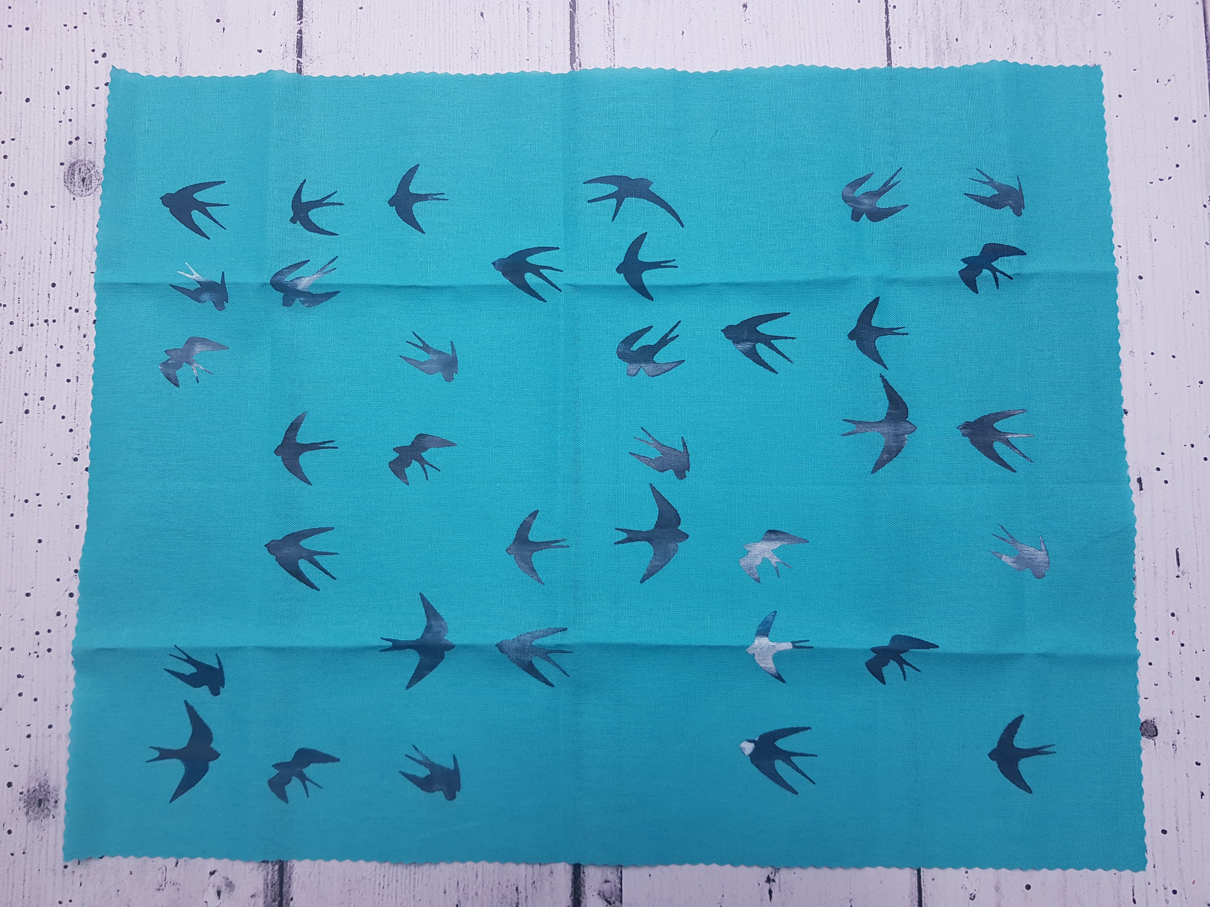 Medium aqua panel with mixed colour swallows